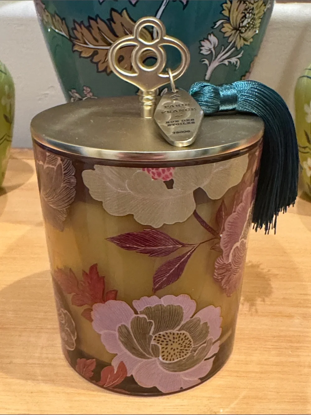 Anthropologie Honeycrisp Oakwood Glass Candle with Gold Lid and Teal Tassel